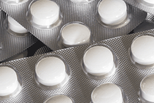 industries_gray_tab_304x204_healthcare_pharmaceutical_white_pills.png
